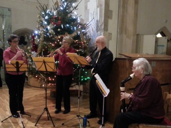 the recorder quartet playing Christmas music as guests arrived.
